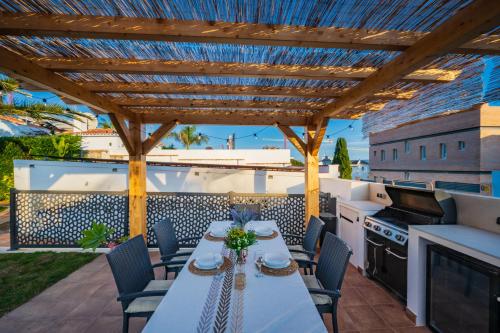 Typical beach house Las Chapas Playa with heated pool