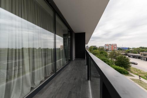 a balcony of a building with a view of a city at Luxury Apartments Babyak in Uzhhorod
