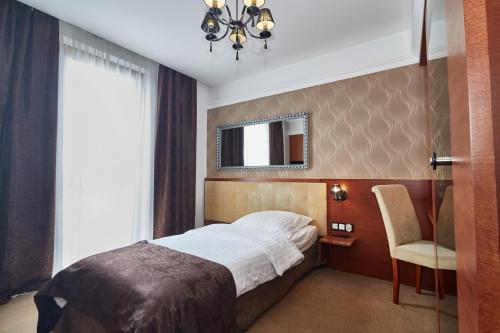 Postel nebo postele na pokoji v ubytování Hotel&Spa Kameleon