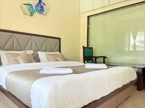 Giường trong phòng chung tại Jariaa Agro Tourism