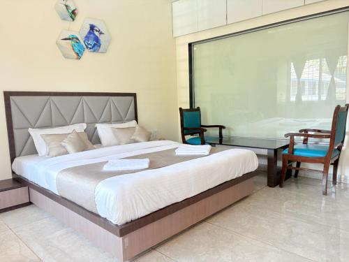 Giường trong phòng chung tại Jariaa Agro Tourism