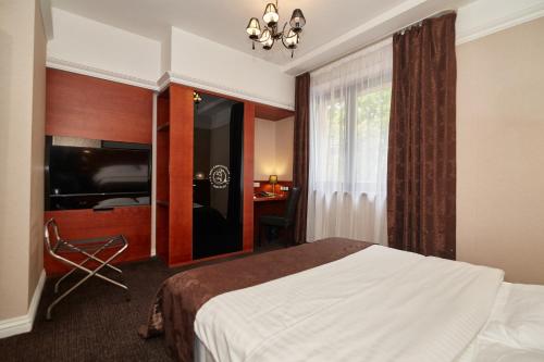 Hotel&Spa Kameleonにあるベッド