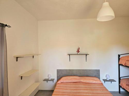 Ένα ή περισσότερα κρεβάτια σε δωμάτιο στο Camping Ulisse Calabria