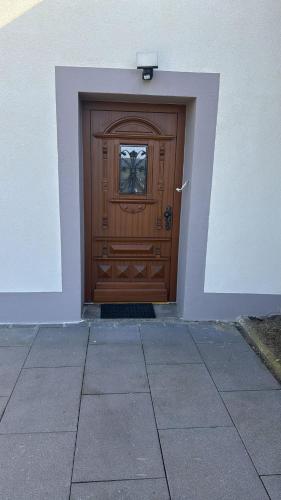 a wooden door with a window in a building at Ferienhaus für max6Gäste 2Kids 4Erwn in Haller