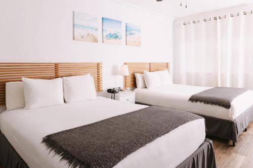 Ένα ή περισσότερα κρεβάτια σε δωμάτιο στο Lorraine Hotel