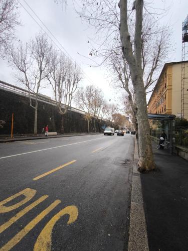 a street with a bus stop painted on the road at Casa Giorgia with Parking Space in Genova