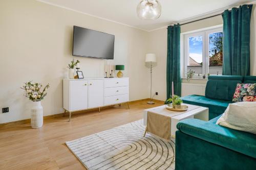 TV a/nebo společenská místnost v ubytování Apartament u Agi 2