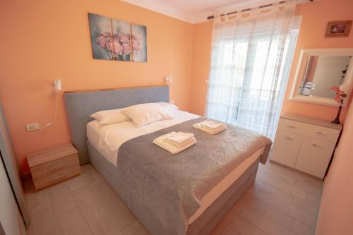 Postel nebo postele na pokoji v ubytování Apartment Ana
