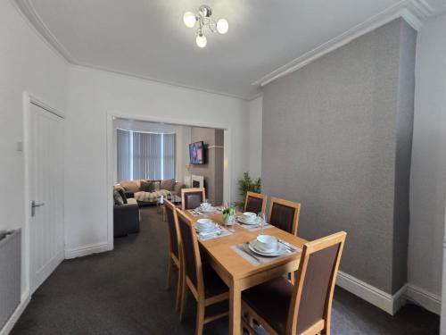 a dining room with a table and chairs at Room 3 Shared house in Kensington in Liverpool