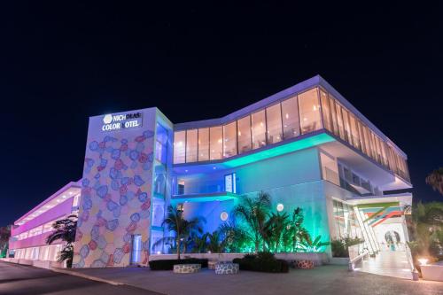 a building that is lit up at night at Nicholas Color Hotel in Ayia Napa