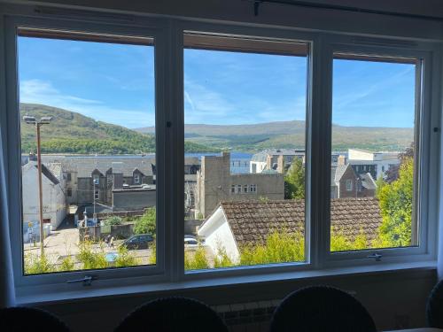 a window with a view of a city at Anagrae in Fort William