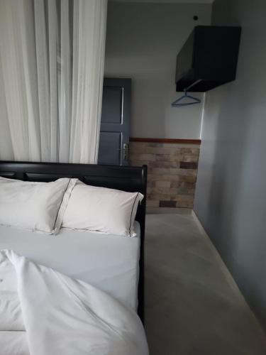 Cama o camas de una habitación en Greena Royal Suites
