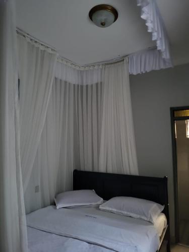 Cama o camas de una habitación en Greena Royal Suites