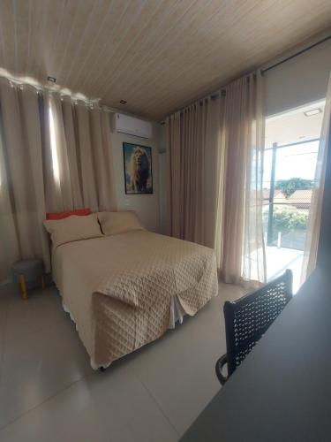 Postel nebo postele na pokoji v ubytování Suítes Vivence Hotel