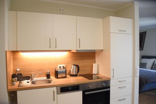 Η κουζίνα ή μικρή κουζίνα στο Charming Homes - Studio 10