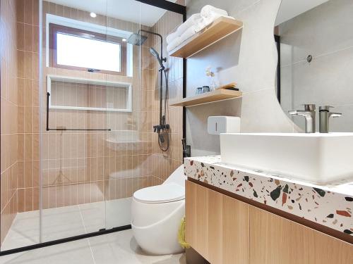 a bathroom with a toilet and a sink and a shower at Meraki Villa Đà Lạt in Khu Chi Lăng