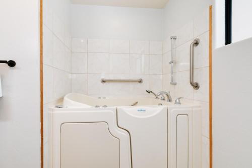 a white bathroom with a sink and a shower at Sleeps 31 10br Mountain View, Pool, Spa and Games in El Cajon