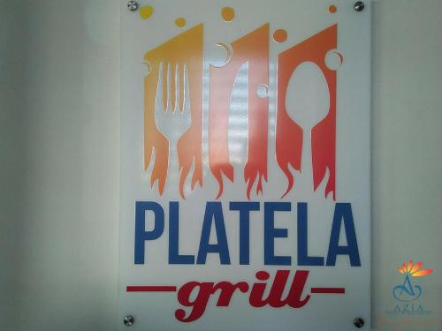 a sign with cutlery on a wall at Azia Suites and Residences in Cebu City