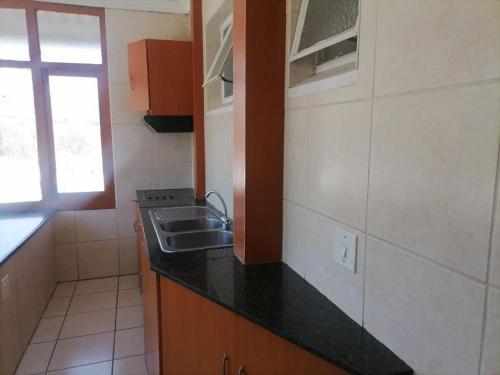 Kuchyň nebo kuchyňský kout v ubytování Triple T Guest house