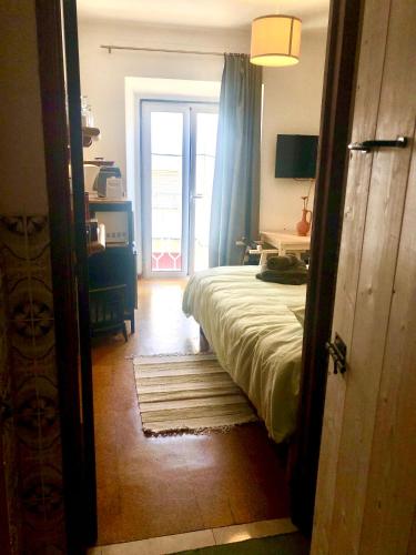 Ένα ή περισσότερα κρεβάτια σε δωμάτιο στο Joao`s INN