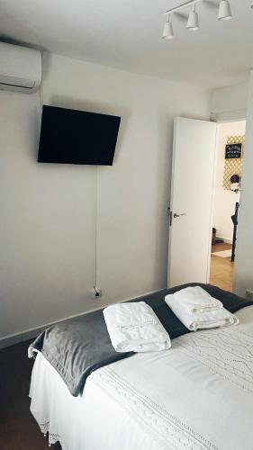 a bedroom with a bed with two pillows on it at Casa Mencía in Camponaraya