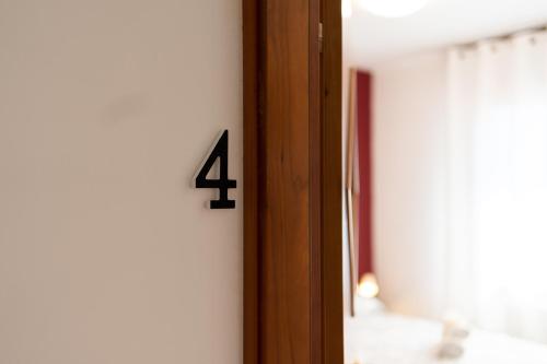 a number four on a wall next to a door at cs veniceflat Apartment - Venice - Apt Vce - 15' from Venice in Tessera