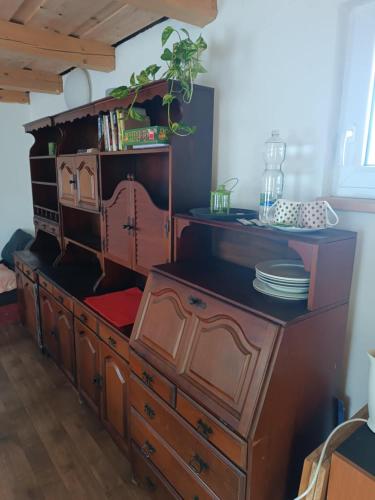 a large wooden dresser with a large drawer at Letní chata u staré cihelny in Škvořetice
