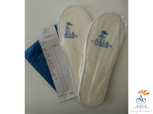 a pair of white shoes in a plastic bag at Azia Suites and Residences in Cebu City