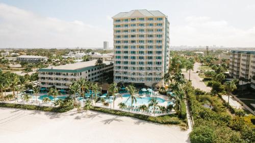 an aerial view of the resort with a pool and buildings at Lido Beach Resort - Sarasota in Sarasota