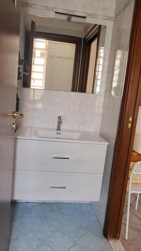 a bathroom with a sink and a mirror at Casa Manzoni in Novara