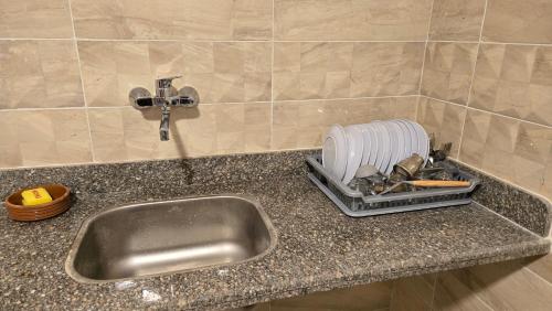 a kitchen counter with a sink and a appliance at 2 Bed Rooms Apartment, Beach Access, El Alamein, 8B401 in El Alamein