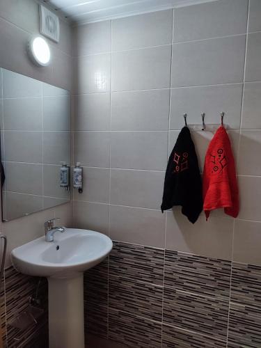 a bathroom with a sink and a mirror at Casa das Escadinhas in Vale de Mendiz