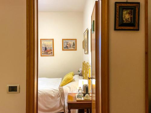 a bedroom with a bed and a table with a night stand at B&B Casa Decimo in Greve in Chianti