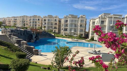 a view of an apartment complex with a swimming pool at New Penthouse, free Beach, pools, and privat roof in Sharm El Sheikh