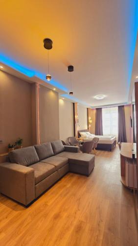 a living room with a couch and a table at Elegance Studios in Vienna