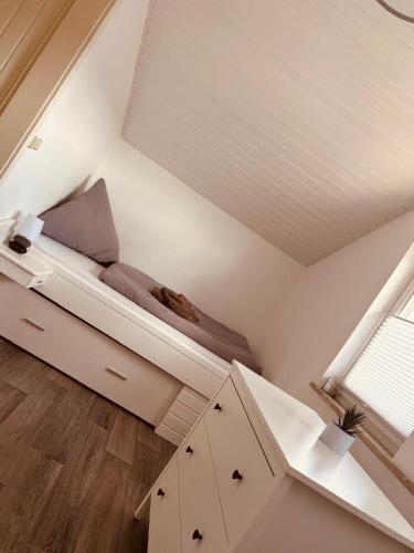 a small bedroom with a bed in the attic at Ferienwohnung Dreiflüsse in Hannoversch Münden