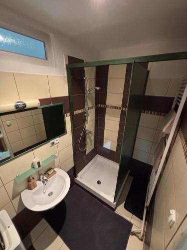 a bathroom with a shower and a sink at apartmán minimal in Spišská Nová Ves