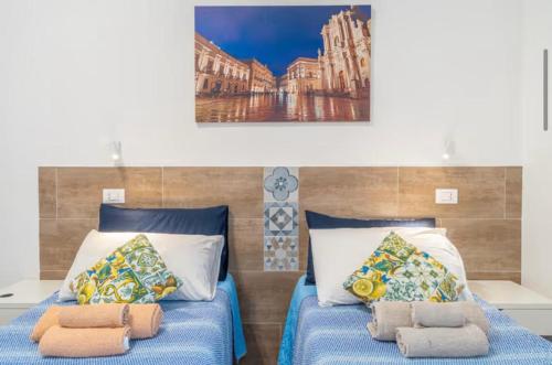 Postel nebo postele na pokoji v ubytování RAUDINO ROOMS