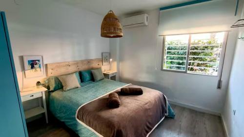 Postel nebo postele na pokoji v ubytování Cala Beach