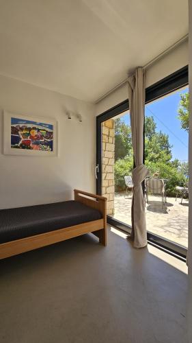 a bedroom with a bed and a large window at Val Mar in Novi Vinodolski