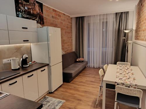 Køkken eller tekøkken på Apartament Centrum Podjasnogórski