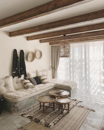 a living room with a couch and a table at Le Sidi Cabana Near Marassi in El Alamein