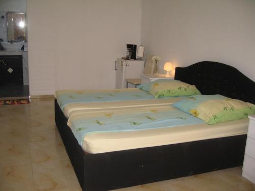 a bedroom with a large bed in a room at KEUR MARIE FAYE in Mbour