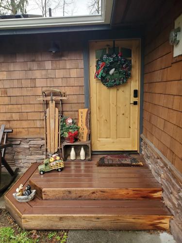 a front door of a house with a wreath on the door at Tony's Riverside Oasis in Sultan