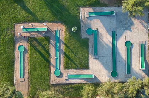an overhead view of a park with green pipes at Kiotari Bay in Kiotari