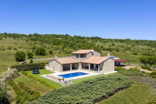 an aerial view of a house with a swimming pool at Heritage Villa Lilly in Krnica