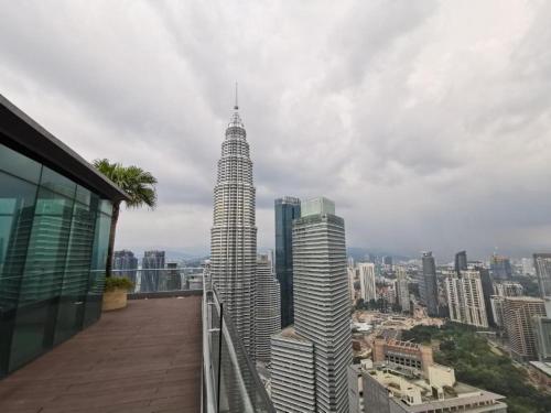 a view of the petronas twin towers from a building at Sky Suites KLCC By Star Apartment in Kuala Lumpur