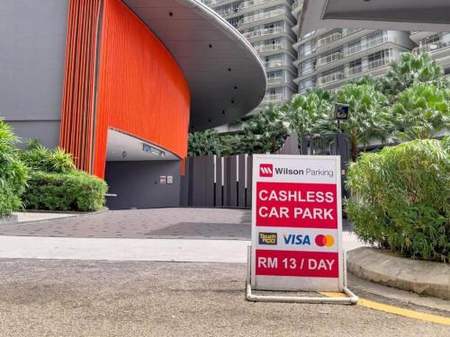 a sign in front of a building with a car park at Sky Suites KLCC By Star Apartment in Kuala Lumpur