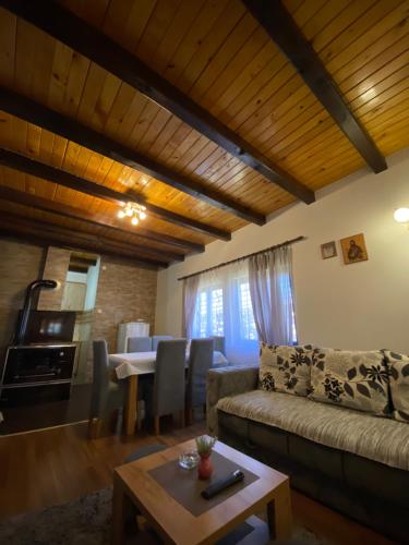 a living room with a couch and a table at Brvnara Sofiana in Bajina Bašta