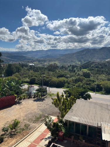 a view from the roof of a house with mountains in the background at Hotel Santafe P&P in Estación El Salto